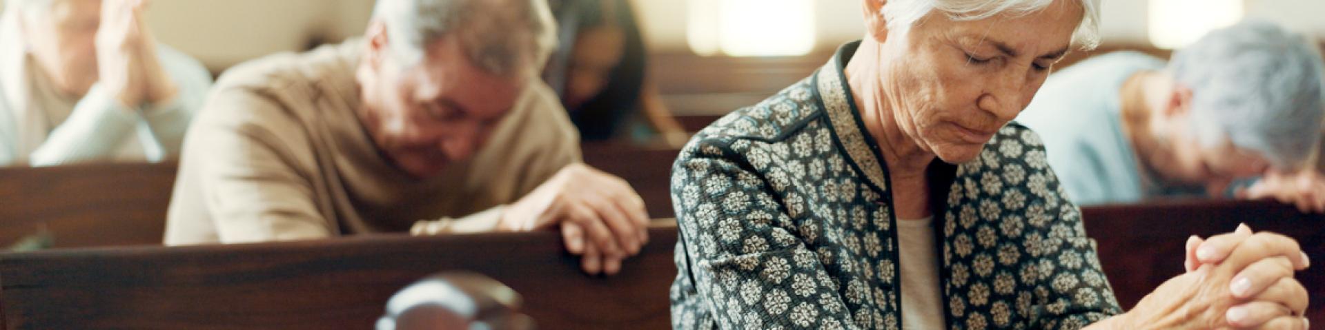 older adults in pews