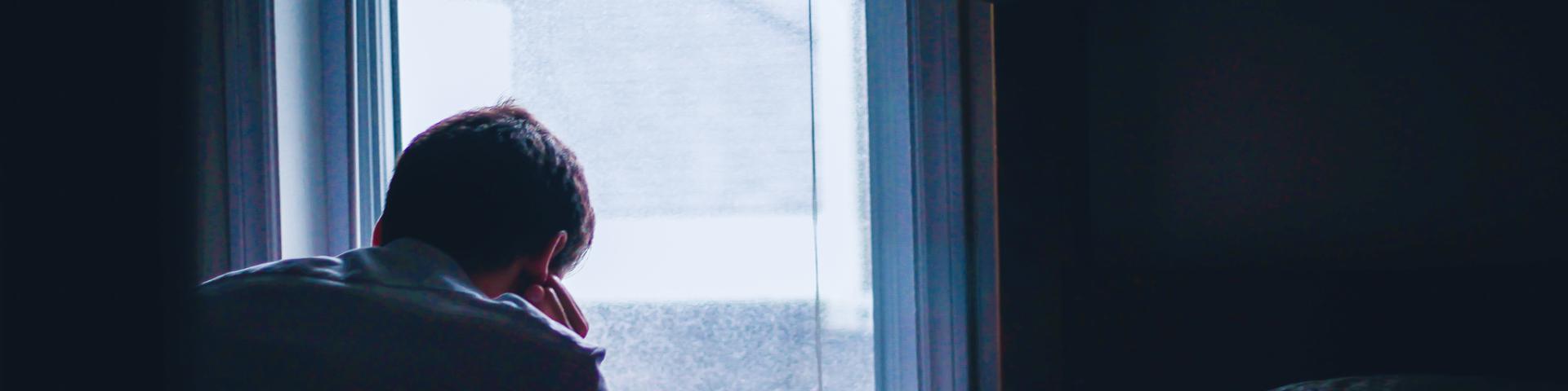 Person looking out the window 