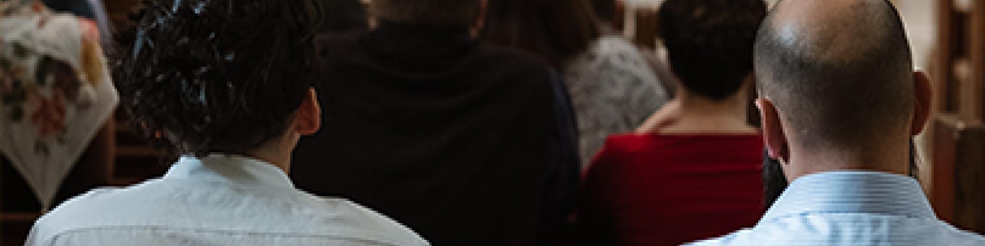 People praying at Mass