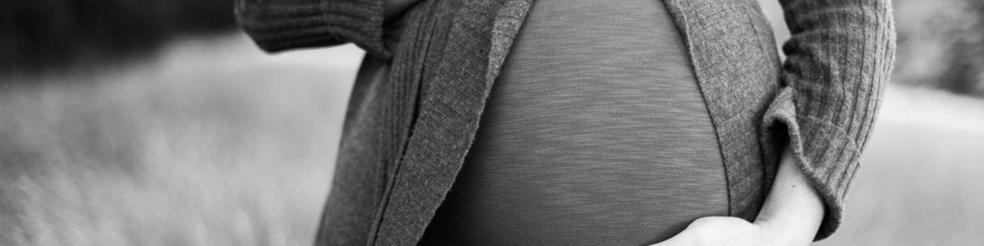 Black and white photo of a pregnant woman 