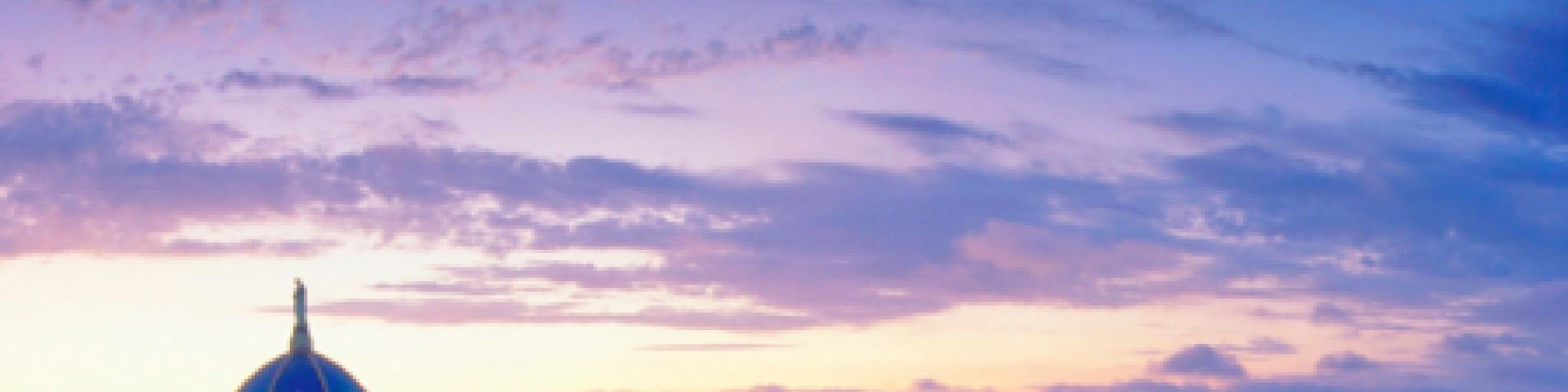 The dome of a Church with a blue/purple sky in the background