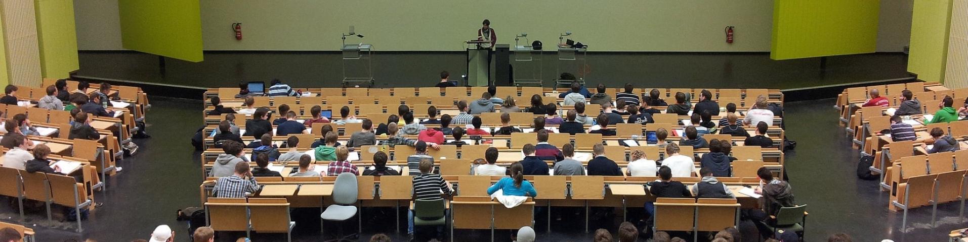 Lecture hall with students and professor