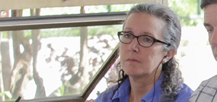 woman using an assistive listening device