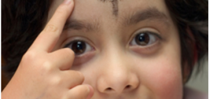 girl with ashes on her forehead 