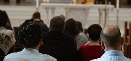 People praying at Mass
