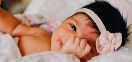 Picture of baby looking t the camera 