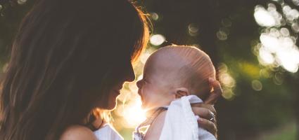 Mother holding her baby