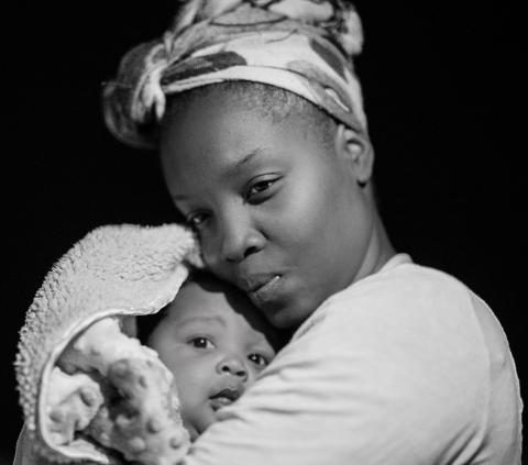 Mother holding her baby