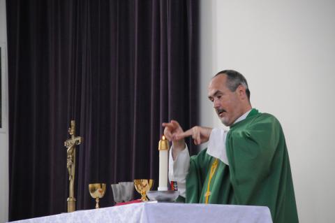 Father Mike Depcik signing Mass during the consecration