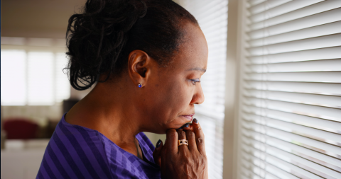 Woman looking out a window