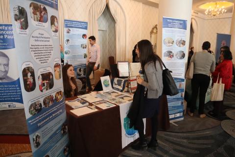 Staff networking and educating at NCPD exhibit table 