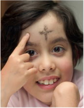 girl with ashes on her forehead 