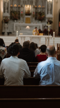 People praying at Mass