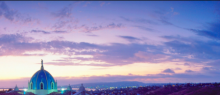 The dome of a Church with a blue/purple sky in the background