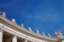 Vatican sculptures of saints with blue sky in the background